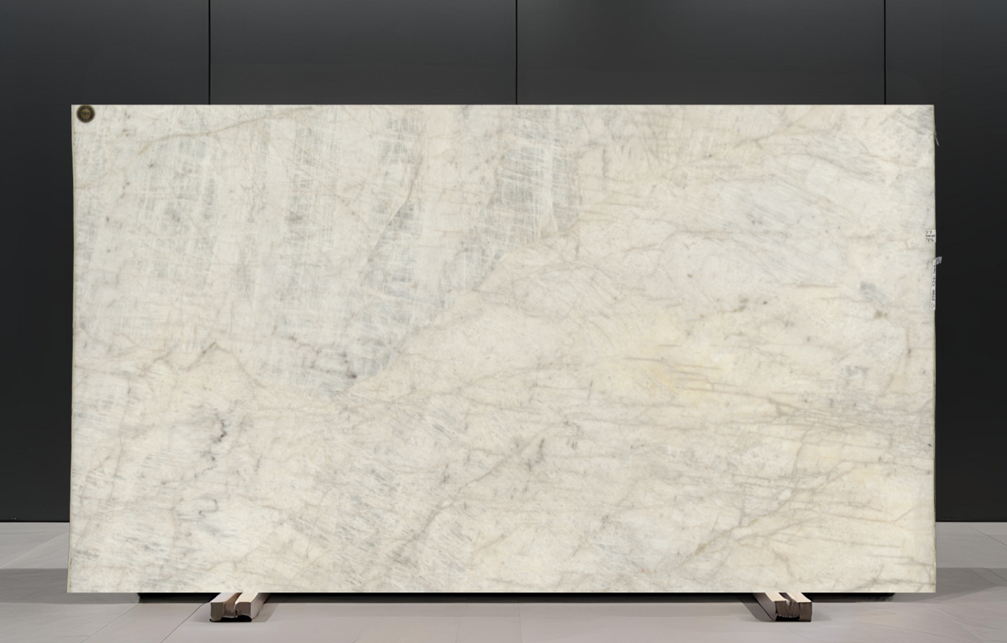Large marble slab with a gray and white pattern on a black background